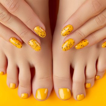 female-legs-hands-with-summer-nail-design-orange-background